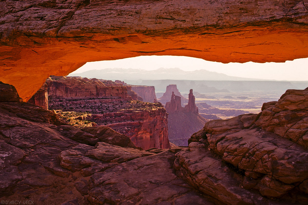 Mesa Arch frames canyons with Washer Woman Arch in distance, Islands In The Sky, Canyonlands National Park, Utah