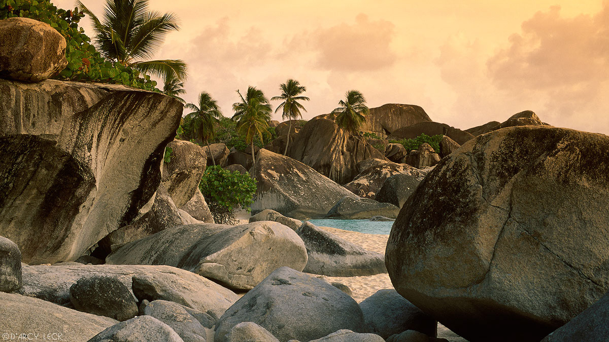 Boulders line the beach at The Baths at sunset on Virgin Gorda, British Virgin Islands