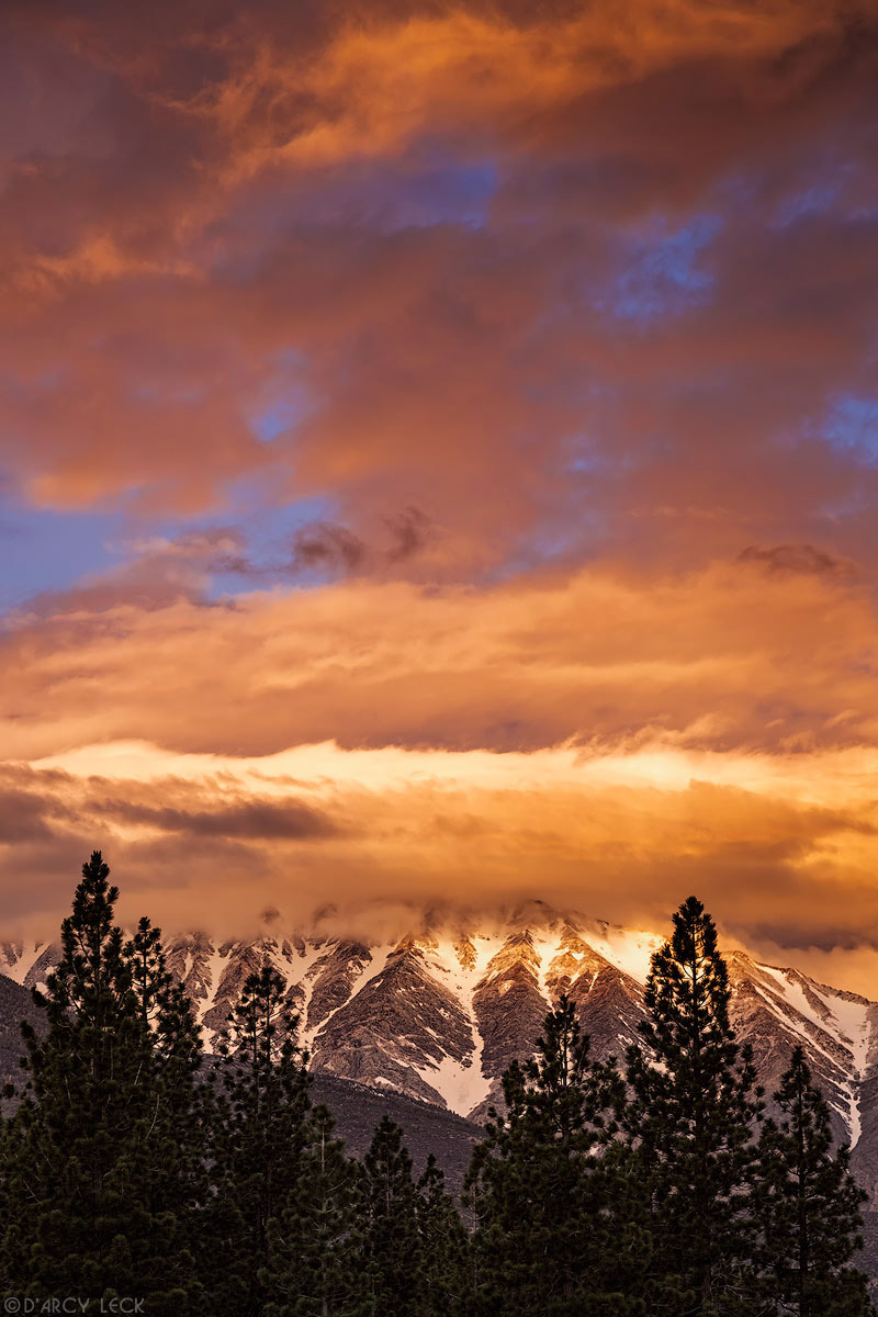 Clearing storm clouds enshroud Wheeler Ridge and Round Valley Peak at sunrise, California