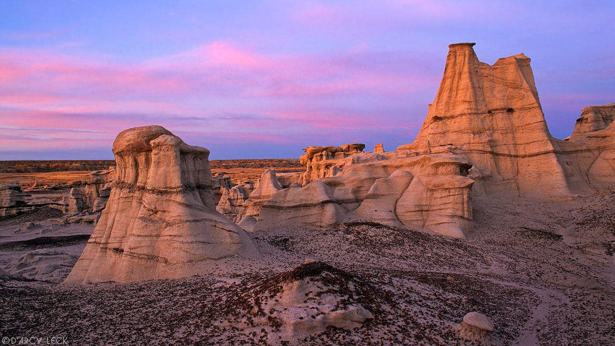 Eroded sandstone formations at dusk in the Bisti Wilderness, New Mexico, USA