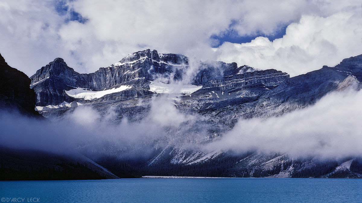 Fog clearing over Bow Lake with Waputik Mountains, Banff National Park, Canada