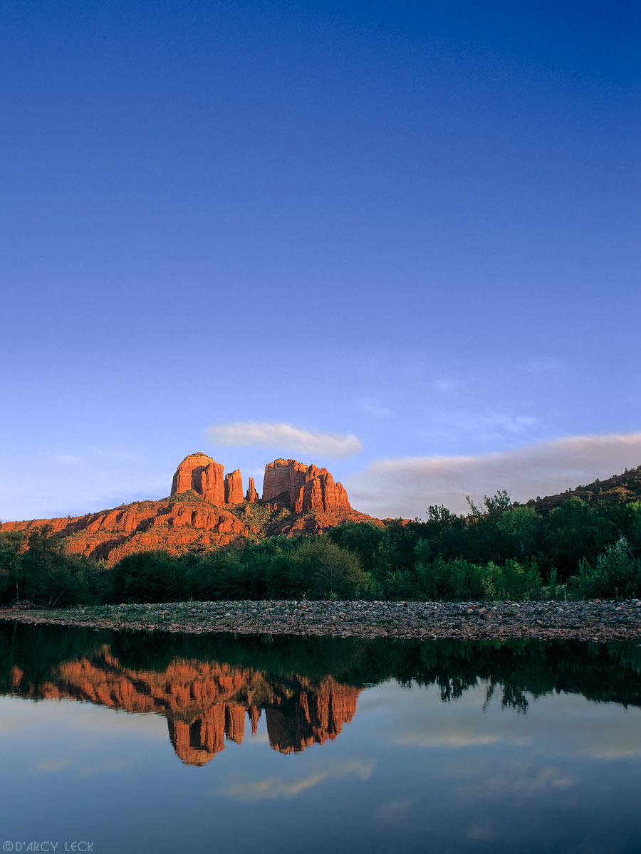 Cathedral Rocks reflect in the still waters of Oak Creek at sunset, Arizona