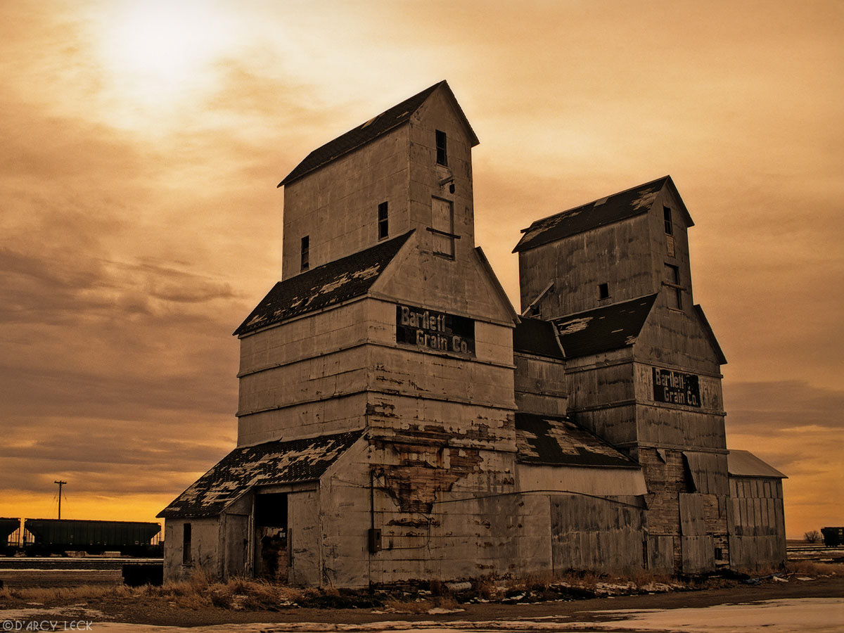 Old grain elevators along railroad in winter in southwestern Kansas