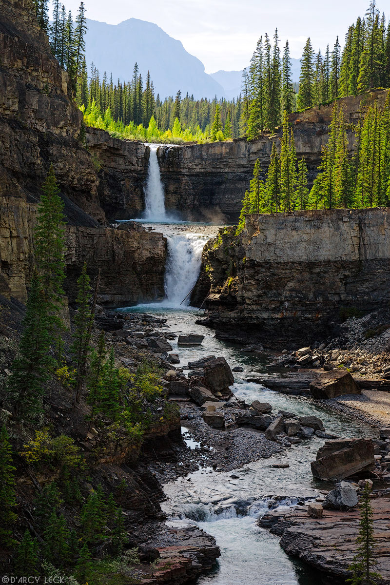 Twin waterfalls form Crescent Falls of the Bighorn River as it plunges into Bighorn Canyon, Alberta, Canada