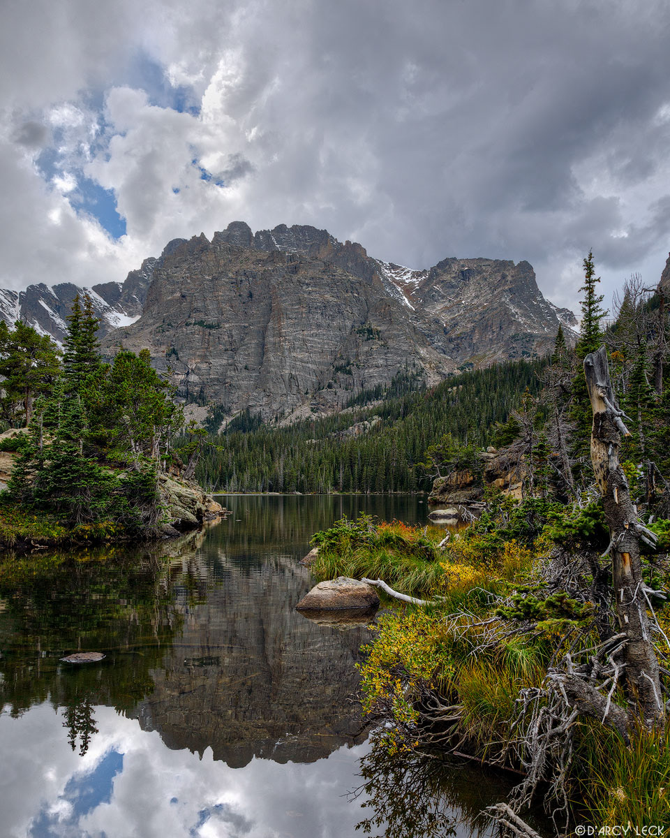 Taylor Peak rises above the alpine lake The Loch, Colorado