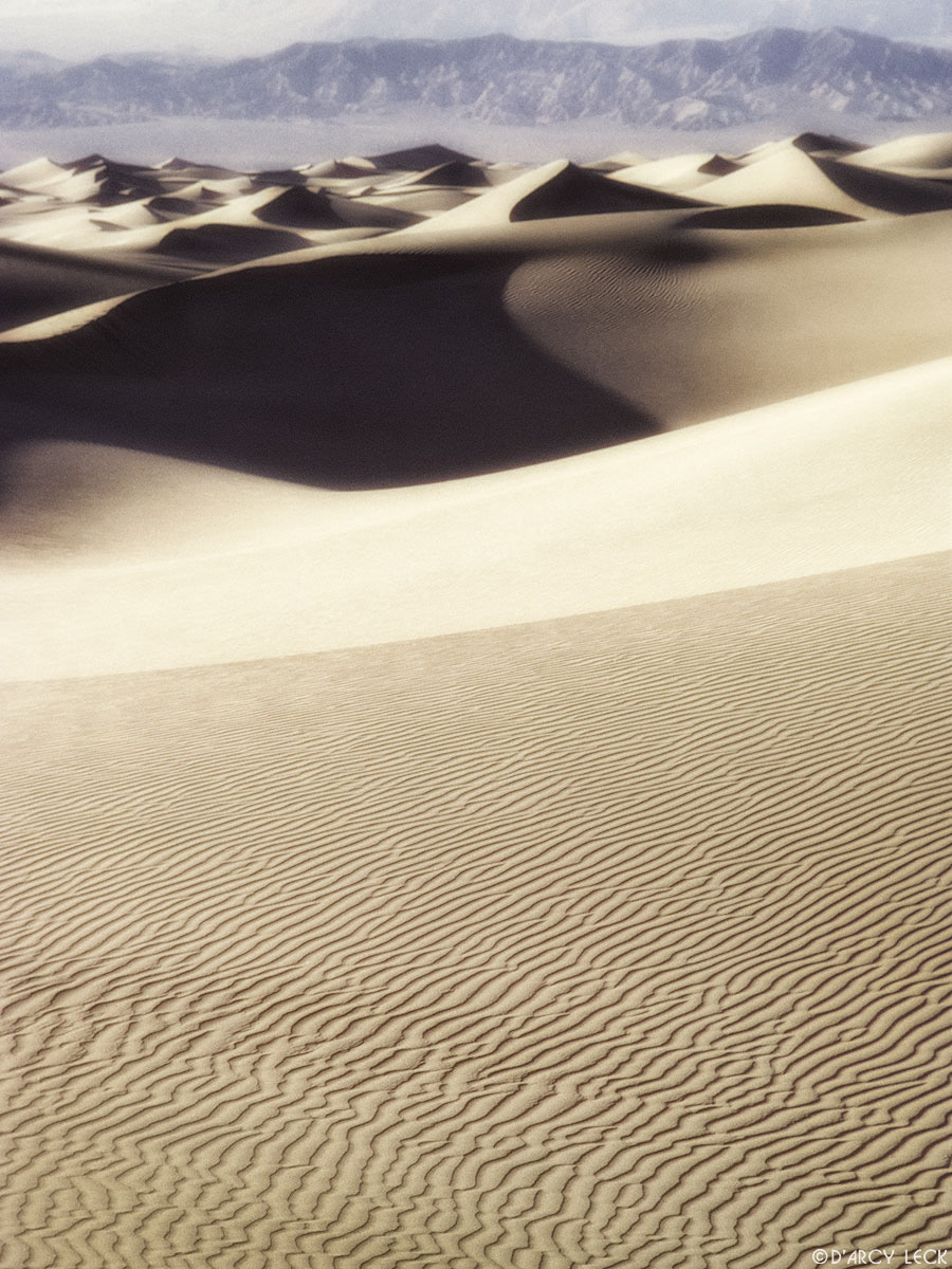 Sand dunes with Panamint mountains in distance, Death Valley National Park, California