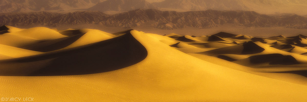 Sand dunes with Panamint mountains in distance, Death Valley National Park, California