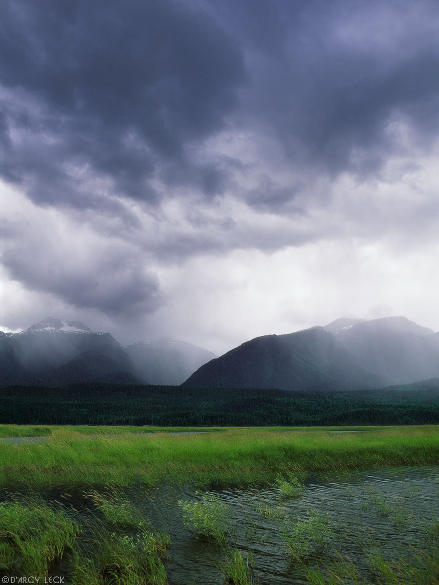 Rain falls on the Hunter Range of the Monashee Mountains beyond the Columbia River, Canada