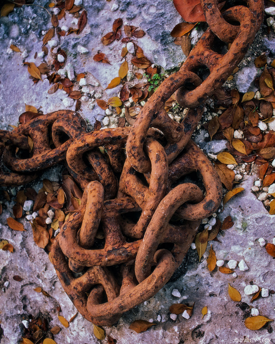 Rusted anchor chain on ground in Marsh Harbor, Bahamas