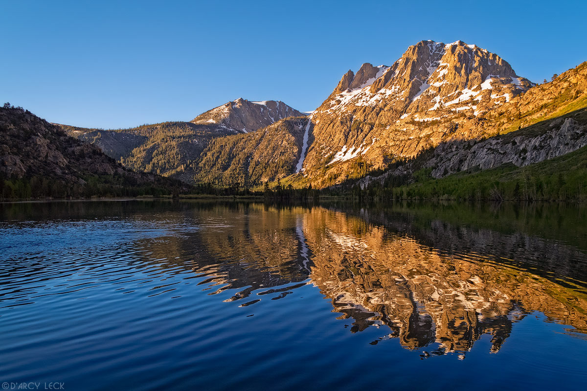 Carson Peak in morning light reflects in Silver Lake, California