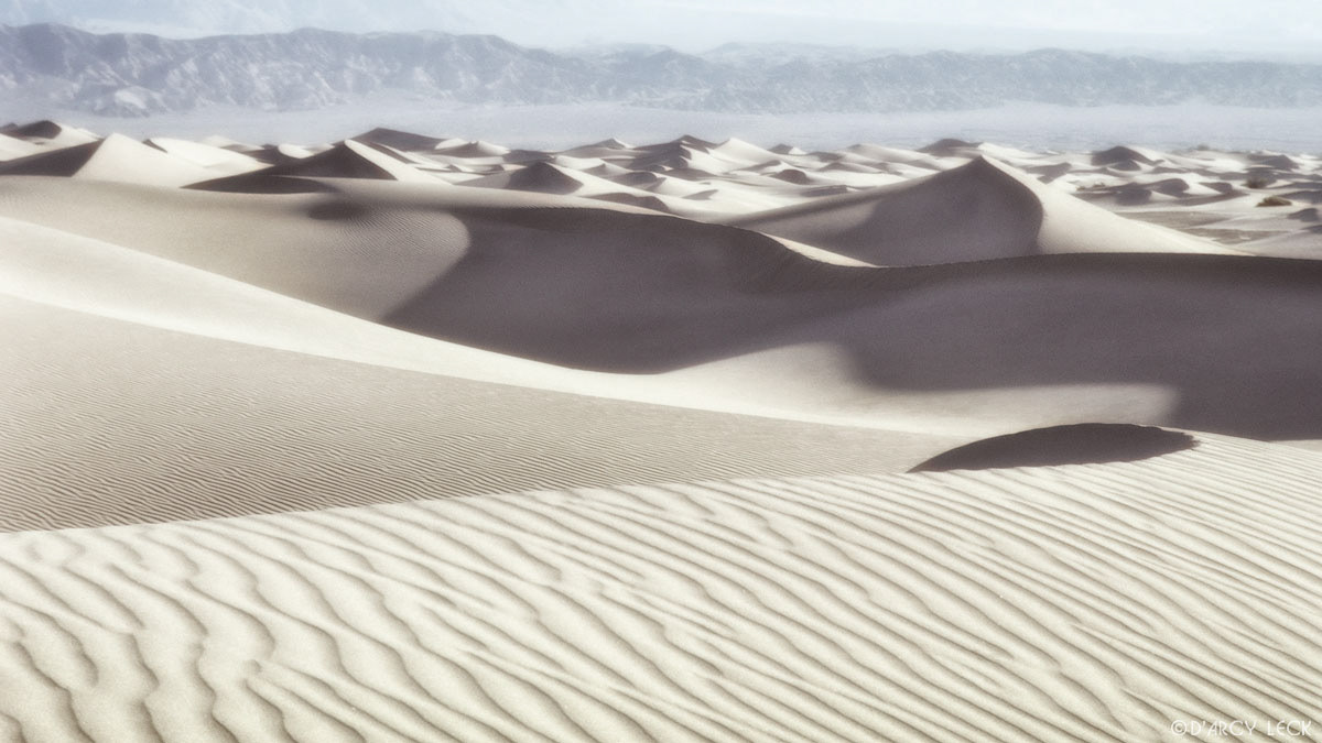 Sand dunes with Panamint mountains in distance, Death Valley National Park, California