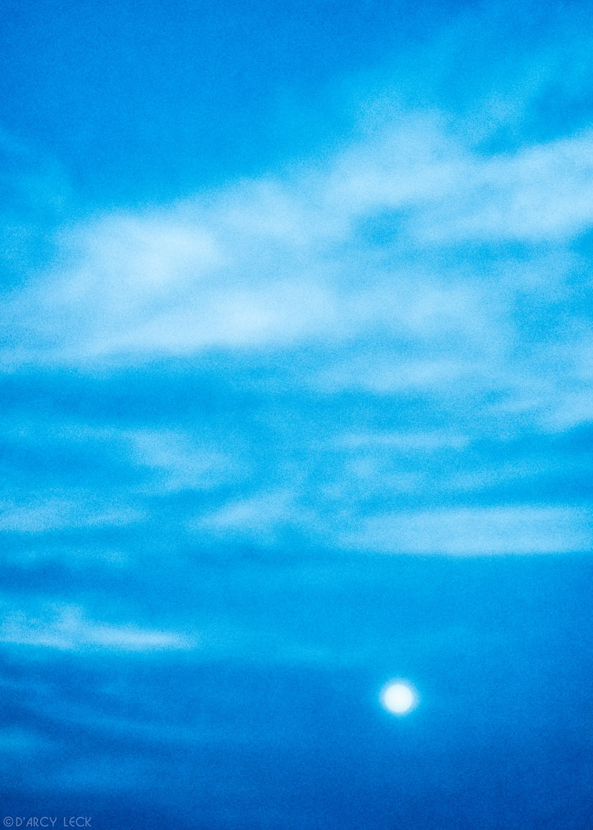 Full moon and cirrus clouds at dusk