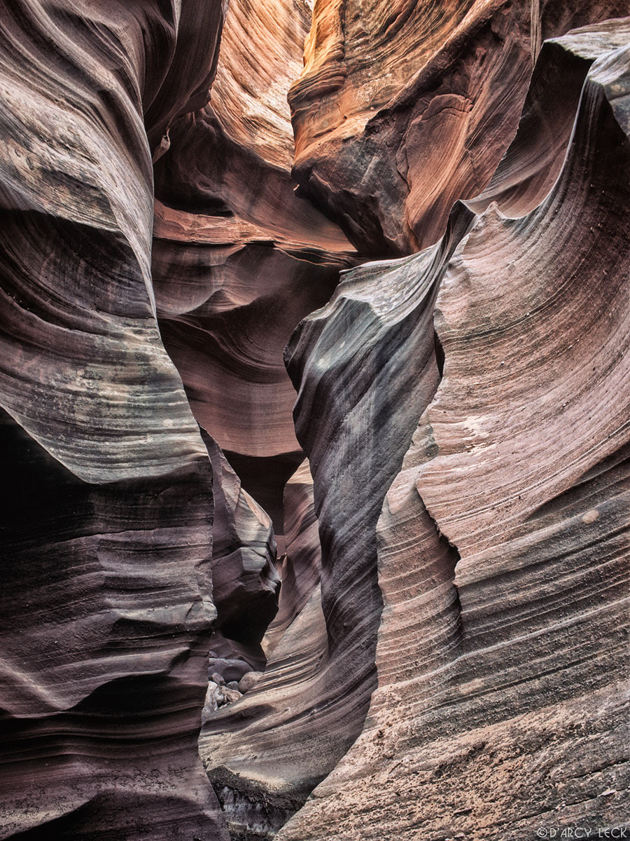 Water-sculpted slot canyon walls in Waterholes Canyon, Arizona