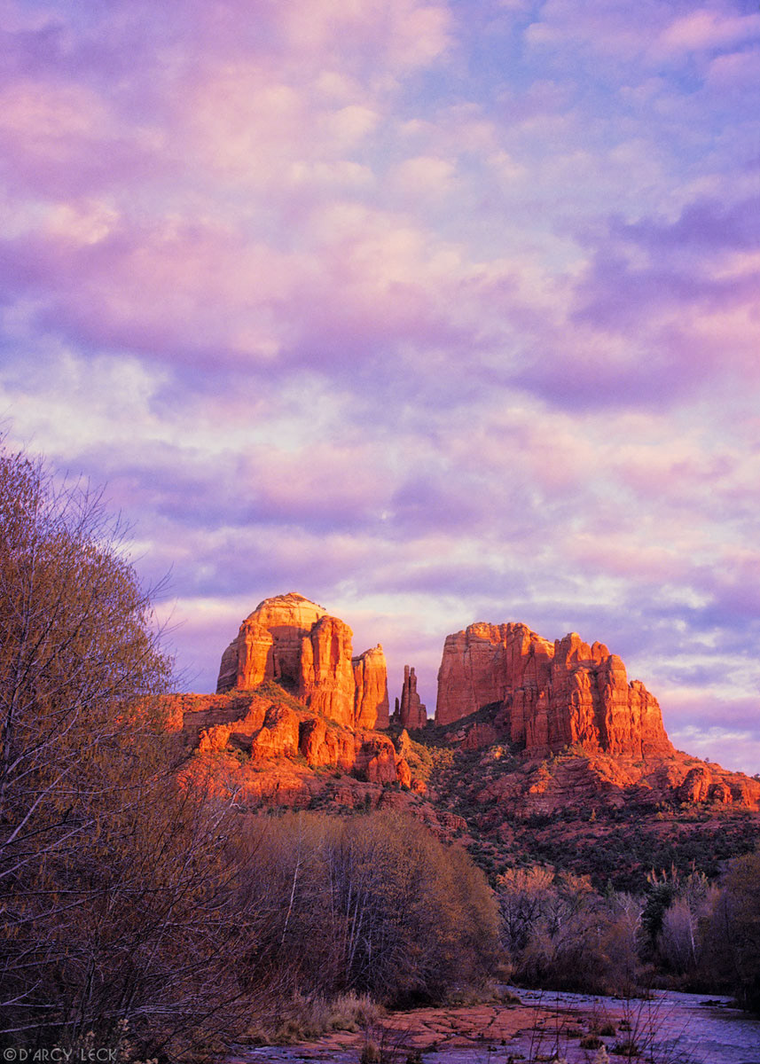 Cathedral Rocks catch the last sunlight at sunset beyond Oak Creek in late autumn