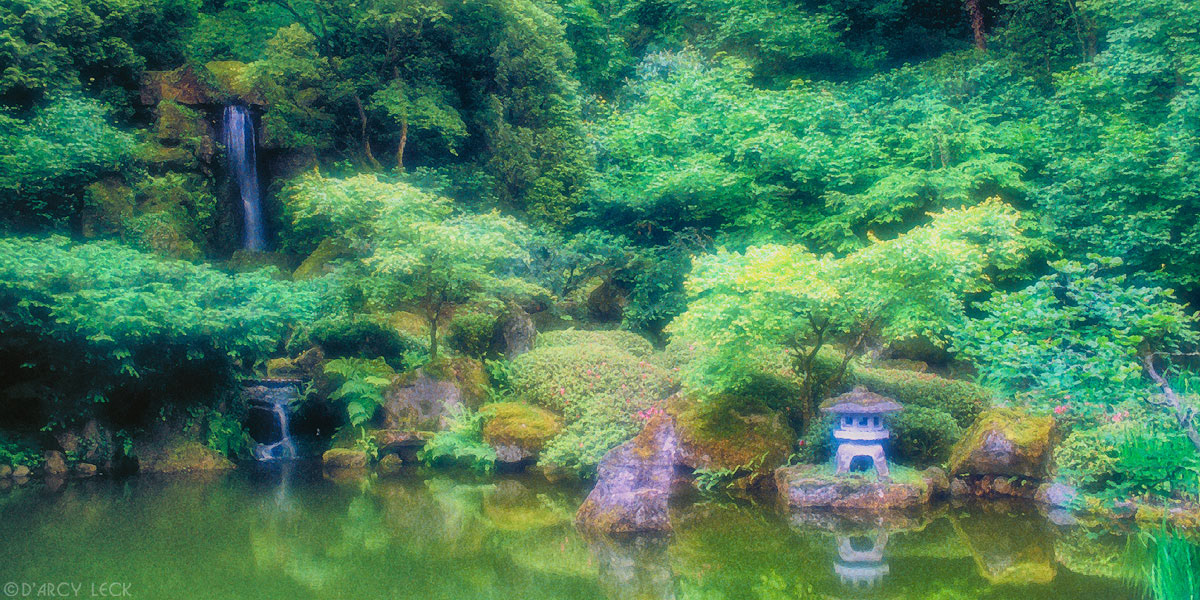 Lamp sits on edge of pond in verdant Japanese Garden in Washington Park, Portland, Oregon