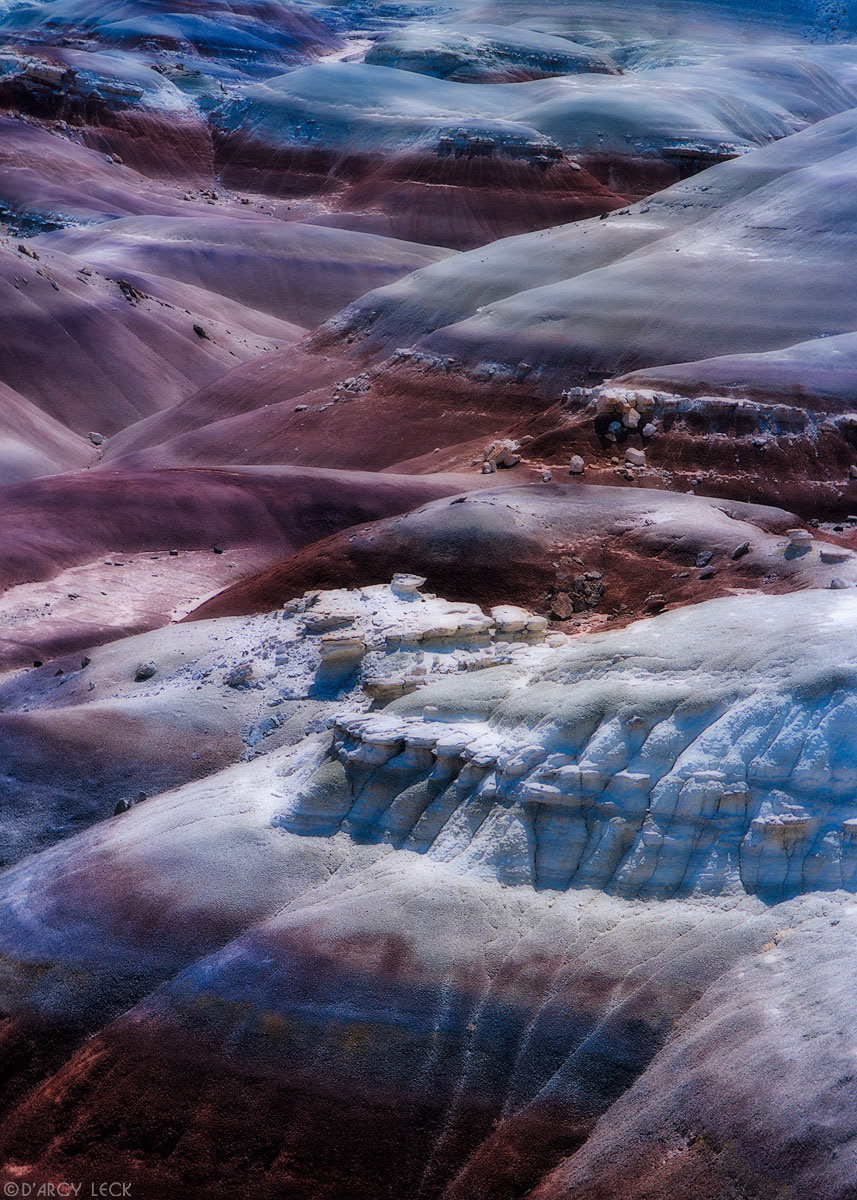 Pastel colors from erosion paint the desert in the Bentonite Hills near Capitol Reef National Park, Utah, USA