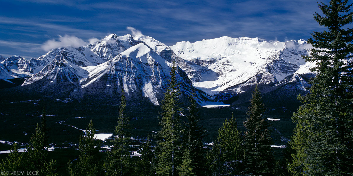 Mount Victoria and mountains of the Bow Range rise above Bow River valley in winter, Banff National Park, Alberta, Canada