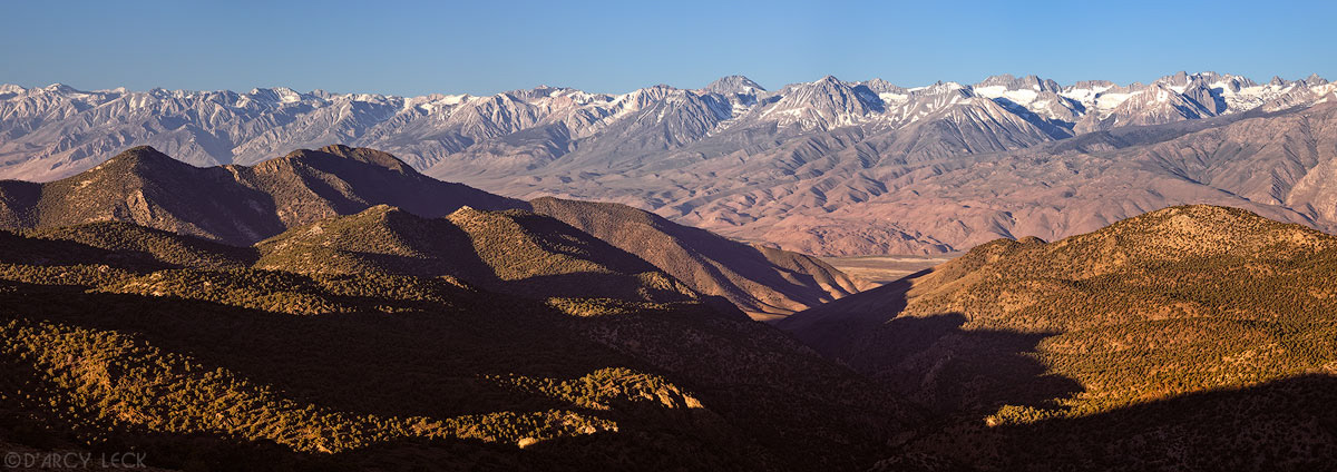 Sierra Nevada mountains in morning light rise above Owens Valley as seen from Sierra Viewpoint in the White Mountains, California