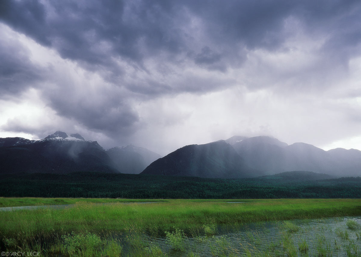 Rain falls on the Hunter Range of the Monashee Mountains beyond the Columbia River, Canada