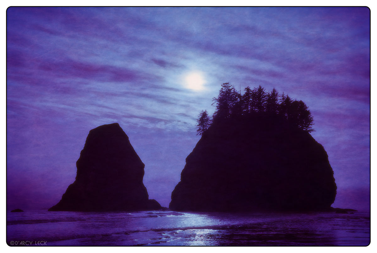 Sea stacks silhouette against sky along Second Beach, Washington