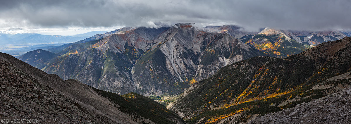 Clouds enshroud peak of Mount Antero to the South as seen from saddle on Mount Princeton; Chalk Creek Valley below, Colorado