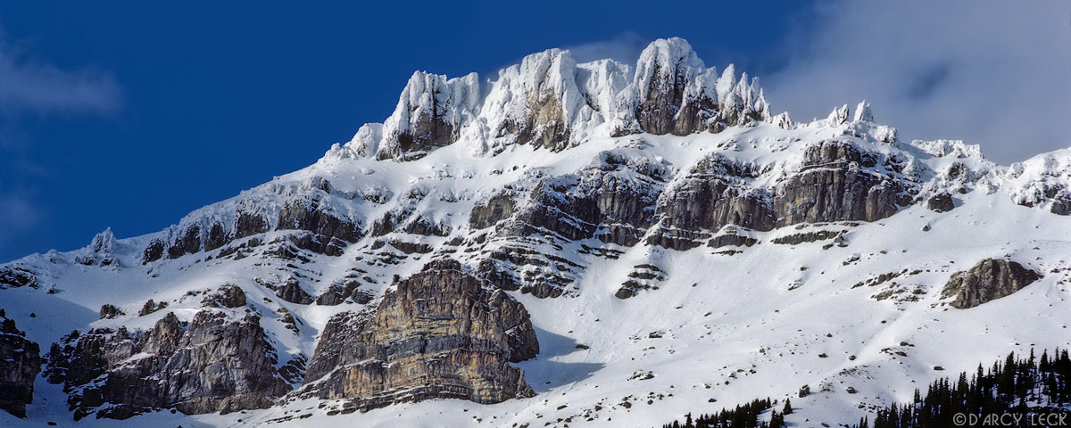 Snow and ice covered peak in the Canadian Rocky Mountains in winter, Banff National Park, Canada