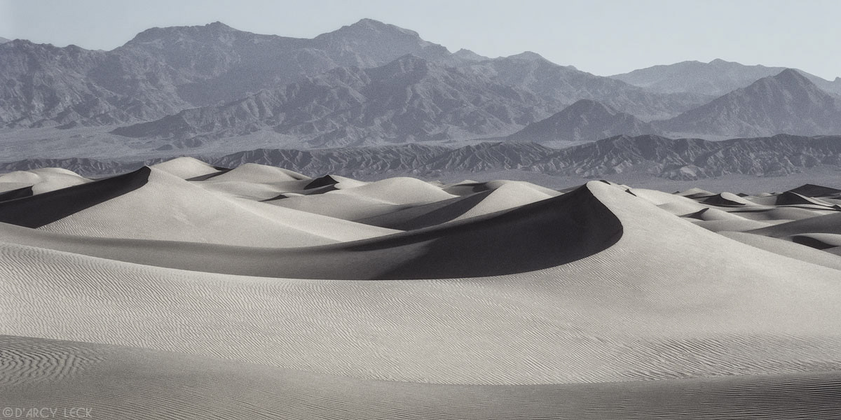 Sand dunes with Panamint mountains in distance, Death Valley National Park, California