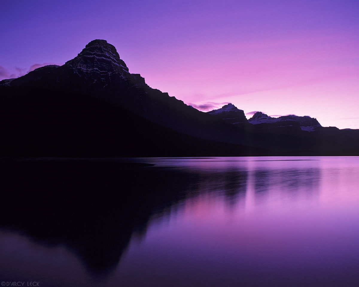 Mount Chephren is reflected in Lower Waterfowl Lake at dusk, Banff National Park, Canada