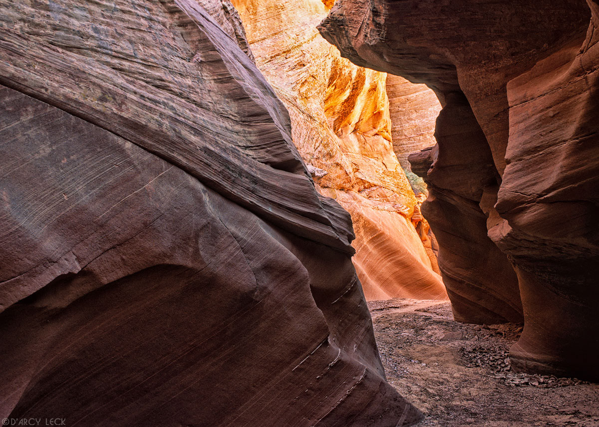 Dried streambed and sandstone walls of slot canyon Waterholes Canyon, Arizona