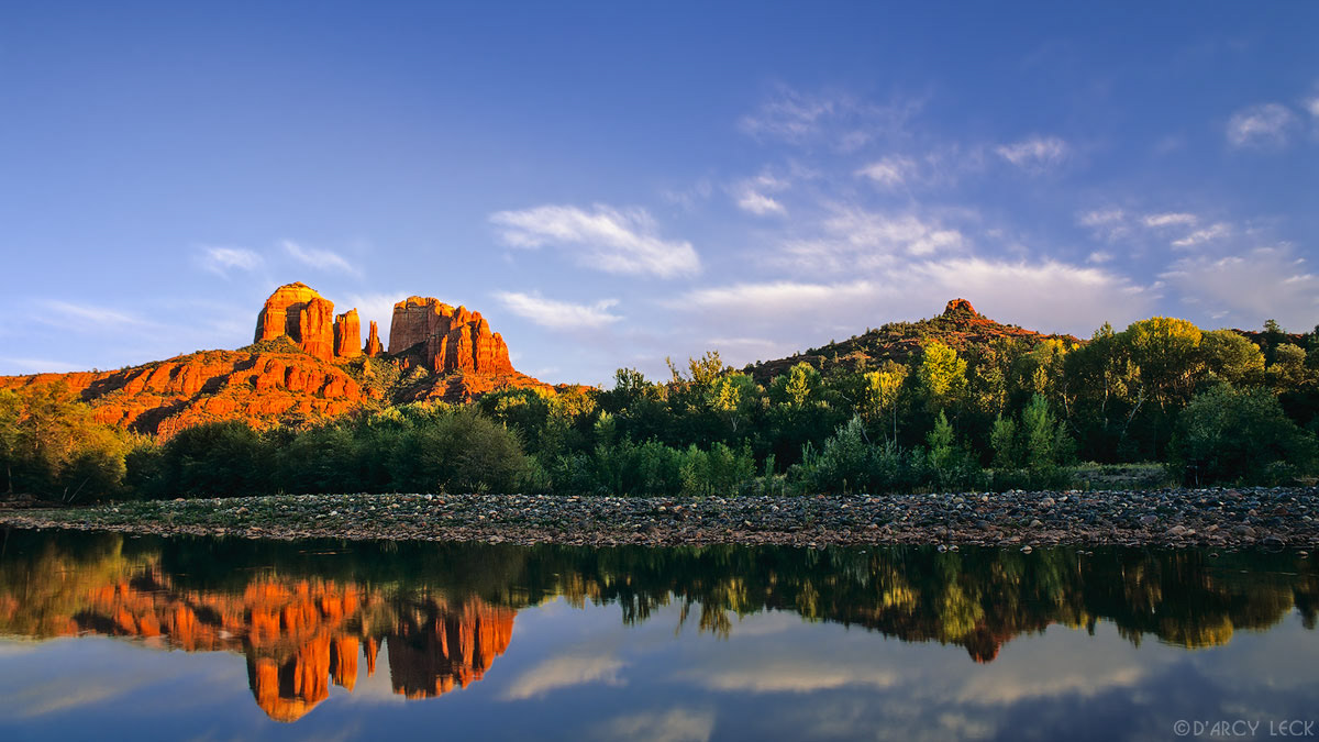Cathedral Rocks reflect in the still waters of Oak Creek at sunset, Arizona