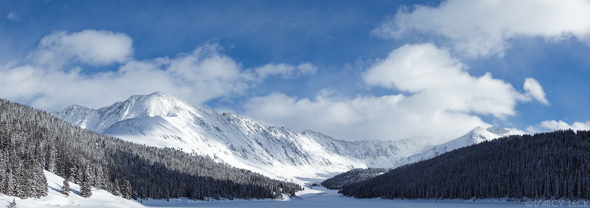Winter afternoon clearing storm at Clinton Gulch Dam Reservoir (Clinton Creek Lake) with Wheeler Mountain in distance, Colorado