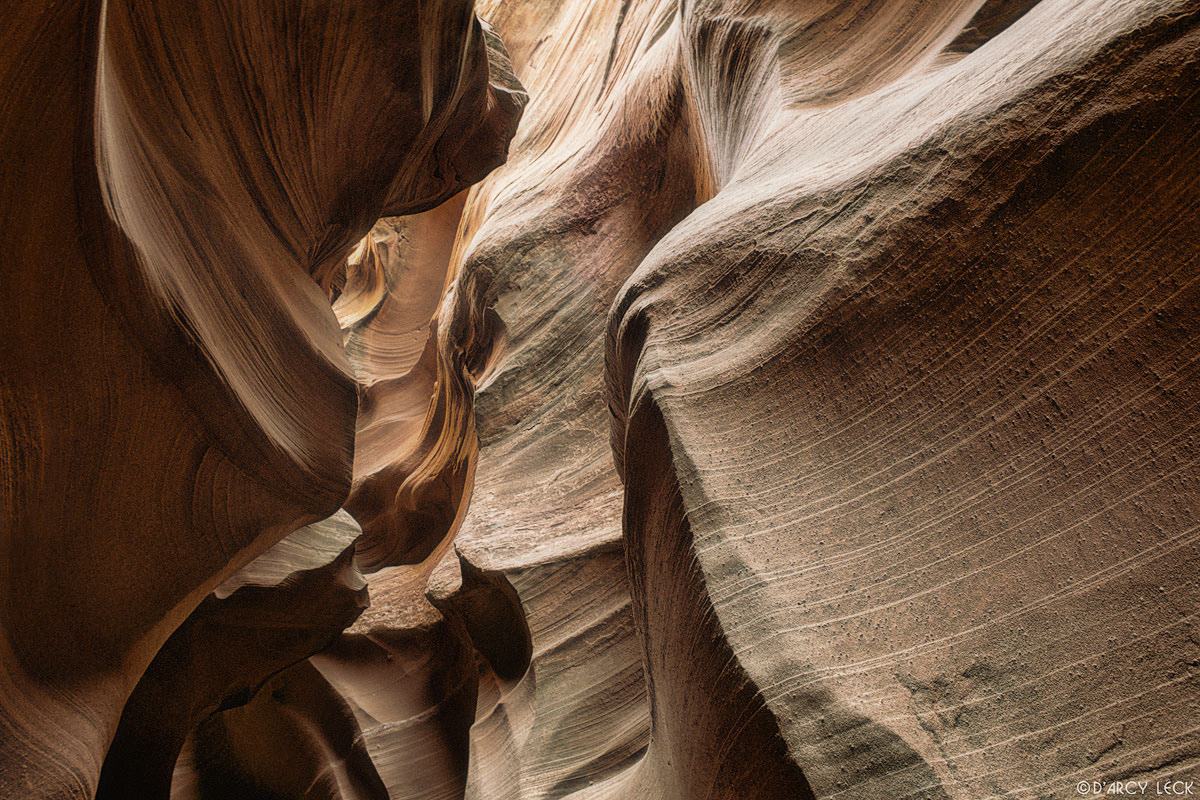 Water-sculpted slot canyon walls in Waterholes Canyon, Arizona
