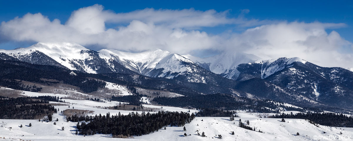Winter clouds clear from Sangre de Cristo Mountains rising above the San Luis Valley, Colorado