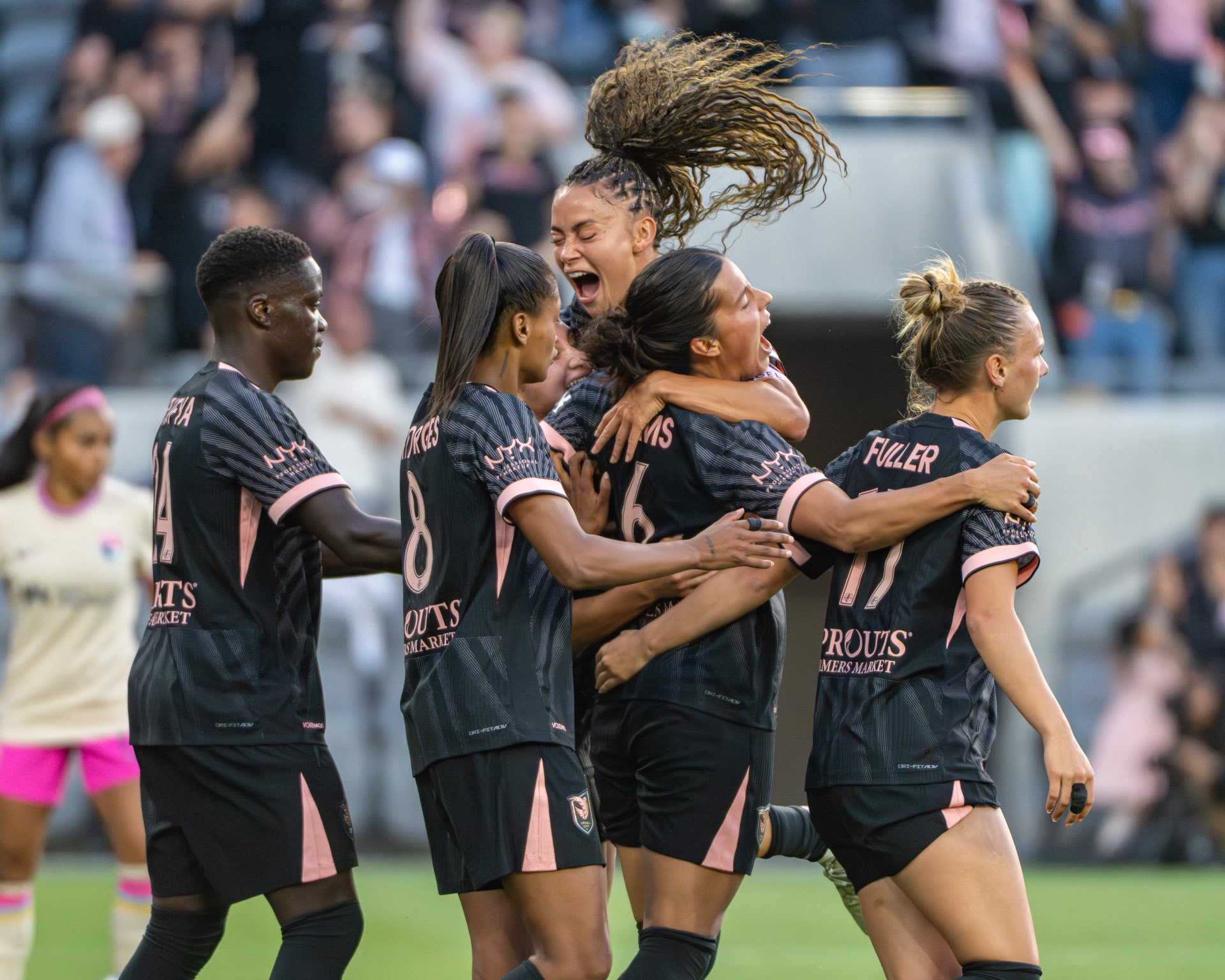 Angel City FC (#11/D) Sarah Gorden celebrates (#6/D) Emily Sam's first home goal for their club on May 9th 2026.