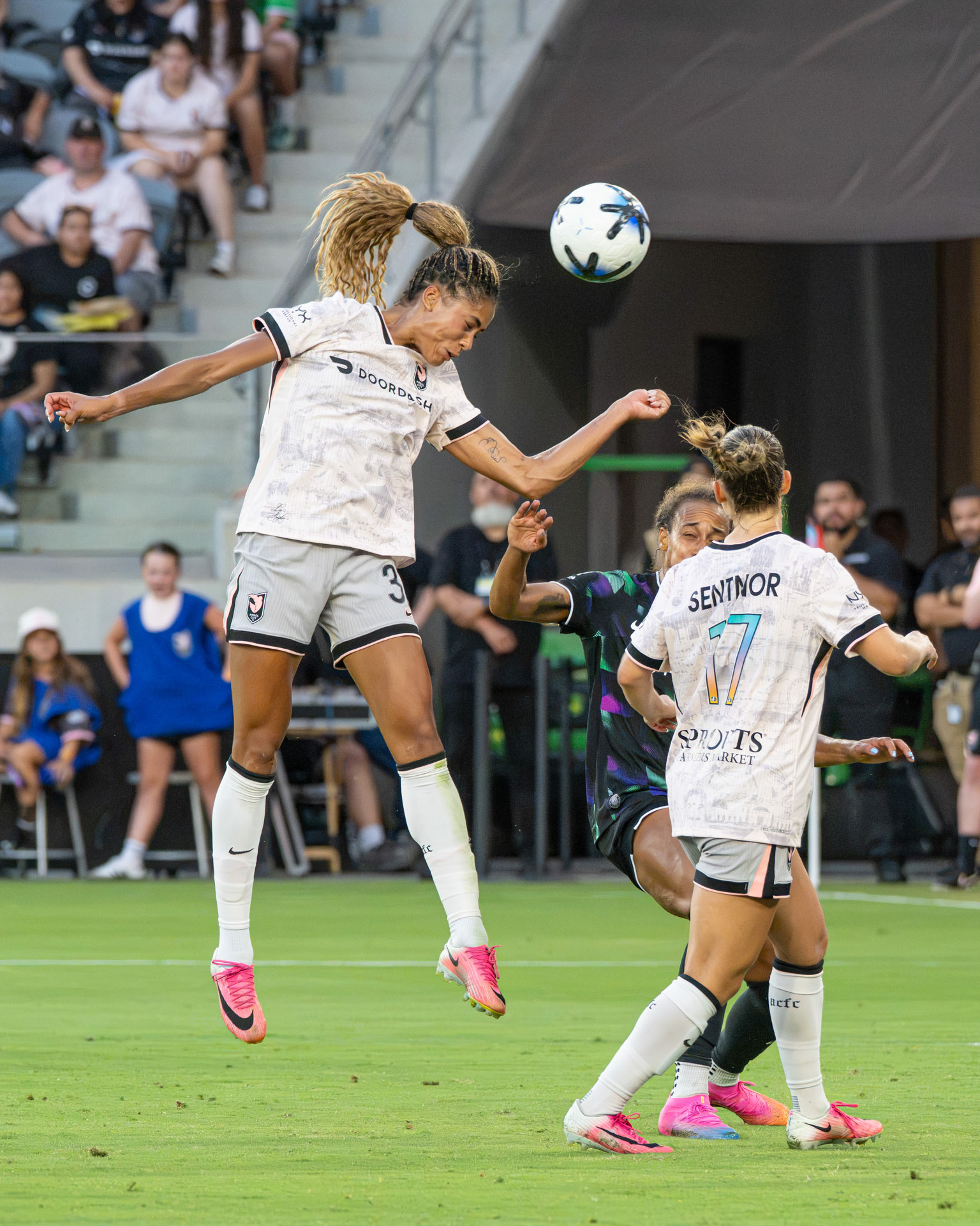Angel City FC Sveindis Jonsdottir (#32/S) heads the ball toward the Racing Louisville goal on July 26th 2026.