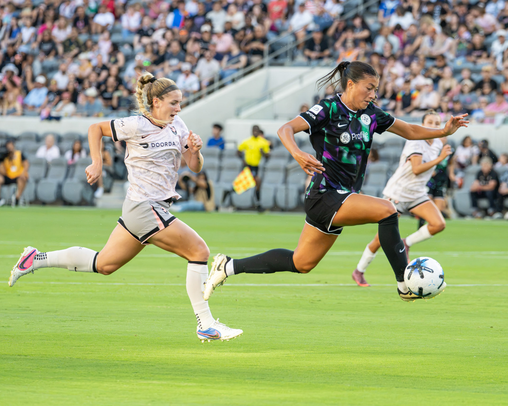 Players glide through the air during Angel City FC vs. Racing Louisville match on July 26th 2026.