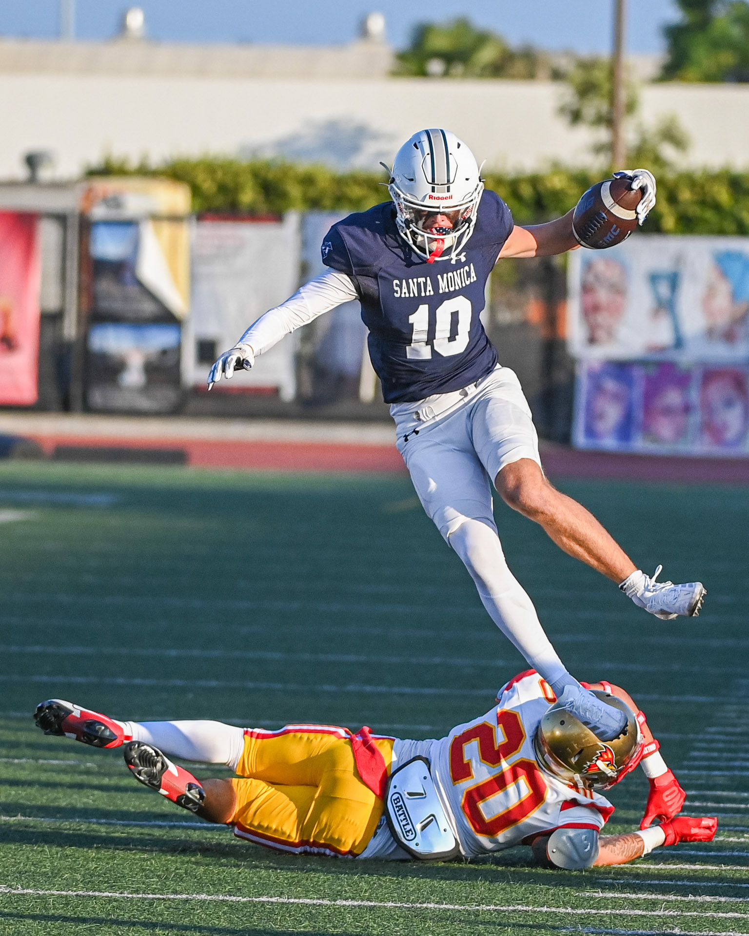 Santa Monica Corsairs' Cody Lambert (#10/WR) hurdles in a linebacker in a blowout win against the Desert Roadrunners during the 2024 season.