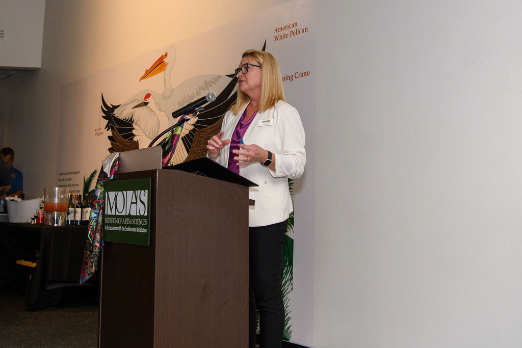 Tabitha Schmidt Welcoming guests to the premier opening of Shoosty Bugs / An Art Infestation