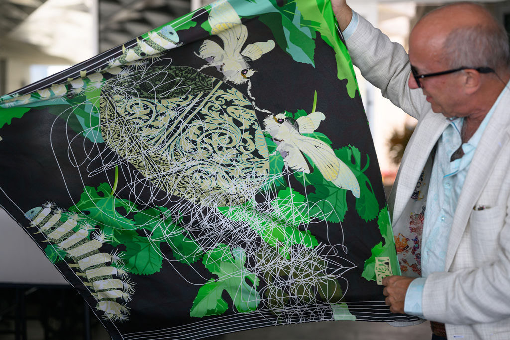 Shoosty examining printed silk