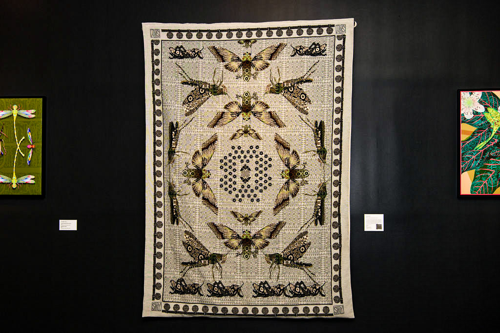 A computer-knit tapestry based on an old Americana tapestry.