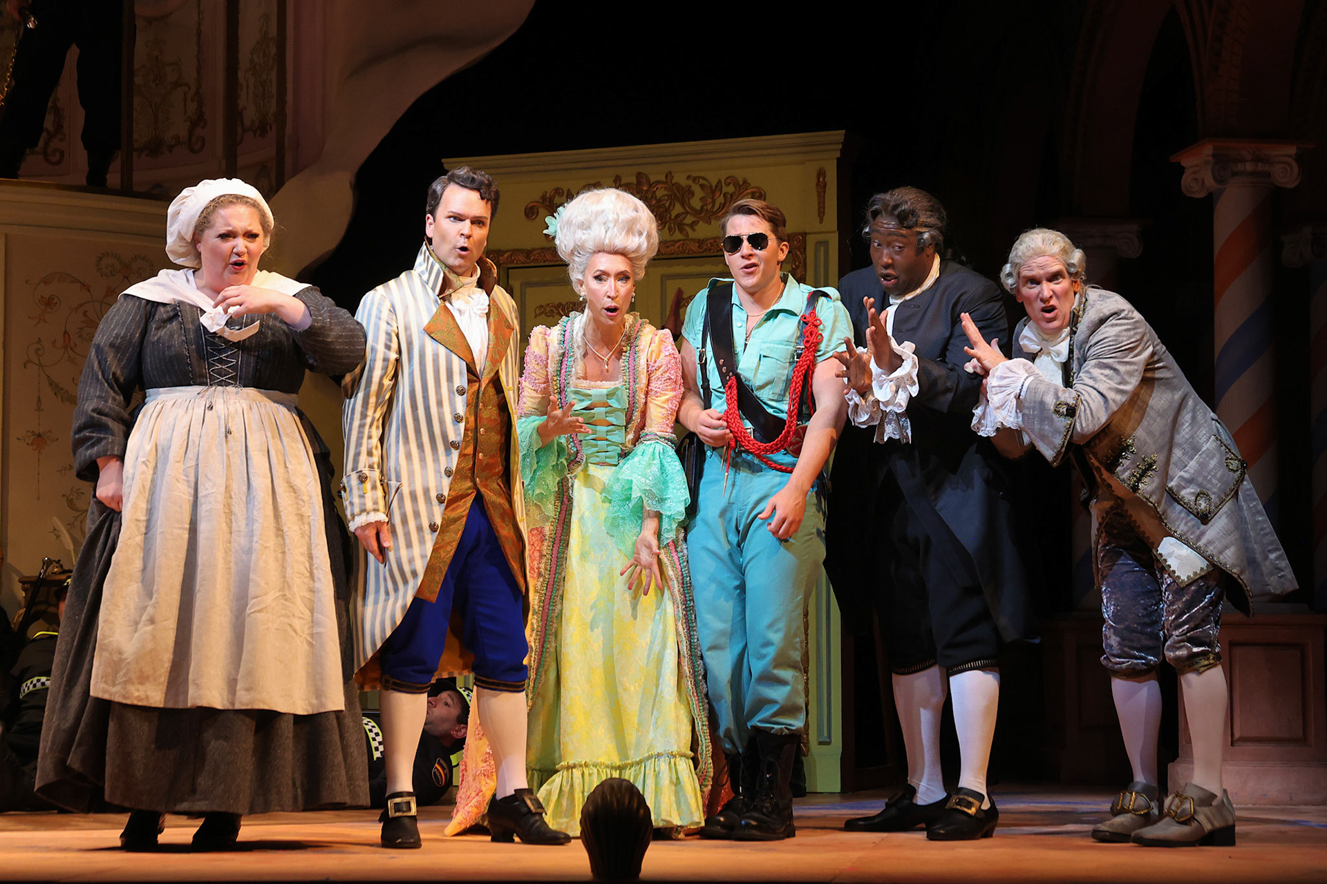 Rosina (c) accompanied by (from left to right) Berta, Count Almaviva, Figaro, and Don Basilio, Dr. Bartolo