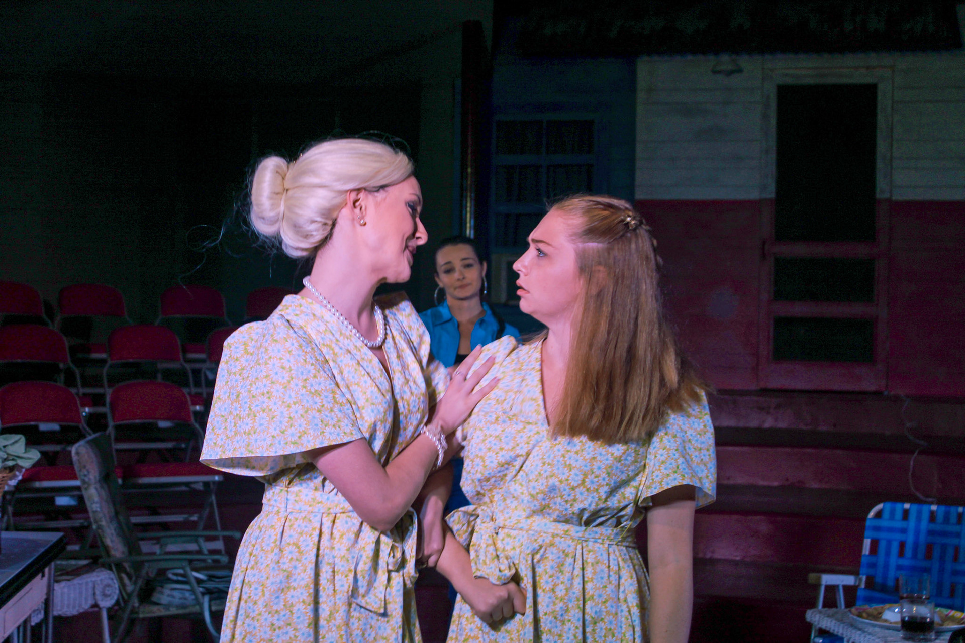 Amy Lee wears a blonde wig and Hattie wears a simple but flattering half-up half-down hair style.