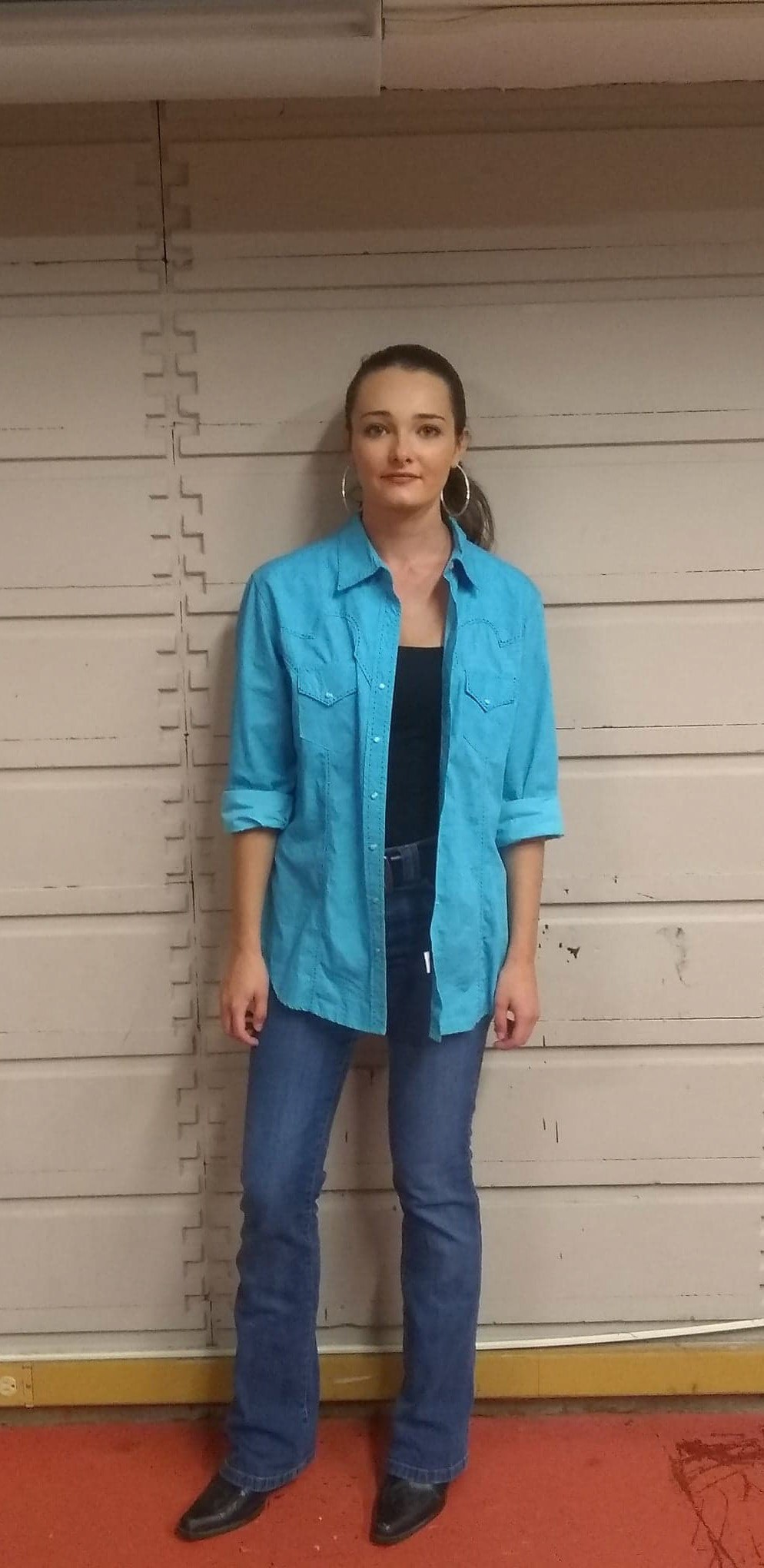 Elizabeth is dressed casually as it is laundry day and she is in a lower economic class than Hattie and Amy Lee.