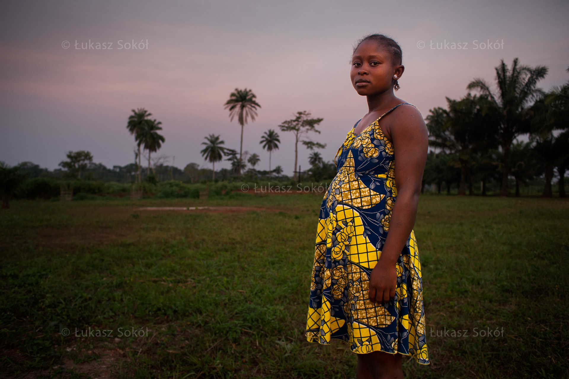 Ambule Dorian, 13 years old, 7 months pregnant. She does not know if she’ll be with the father of her child, she is too young and does not know how life will turn out. He is 20 years old and lives in the capital city, Yaounde. She is an orphan. She lives with her aunt and her second husband, who are childless. She is happy that she will be a mother, but she still does not feel grown-up. She is a 2-year-high school student, she wants to continue education.  Ngelemendouka, Cameroon, 2012