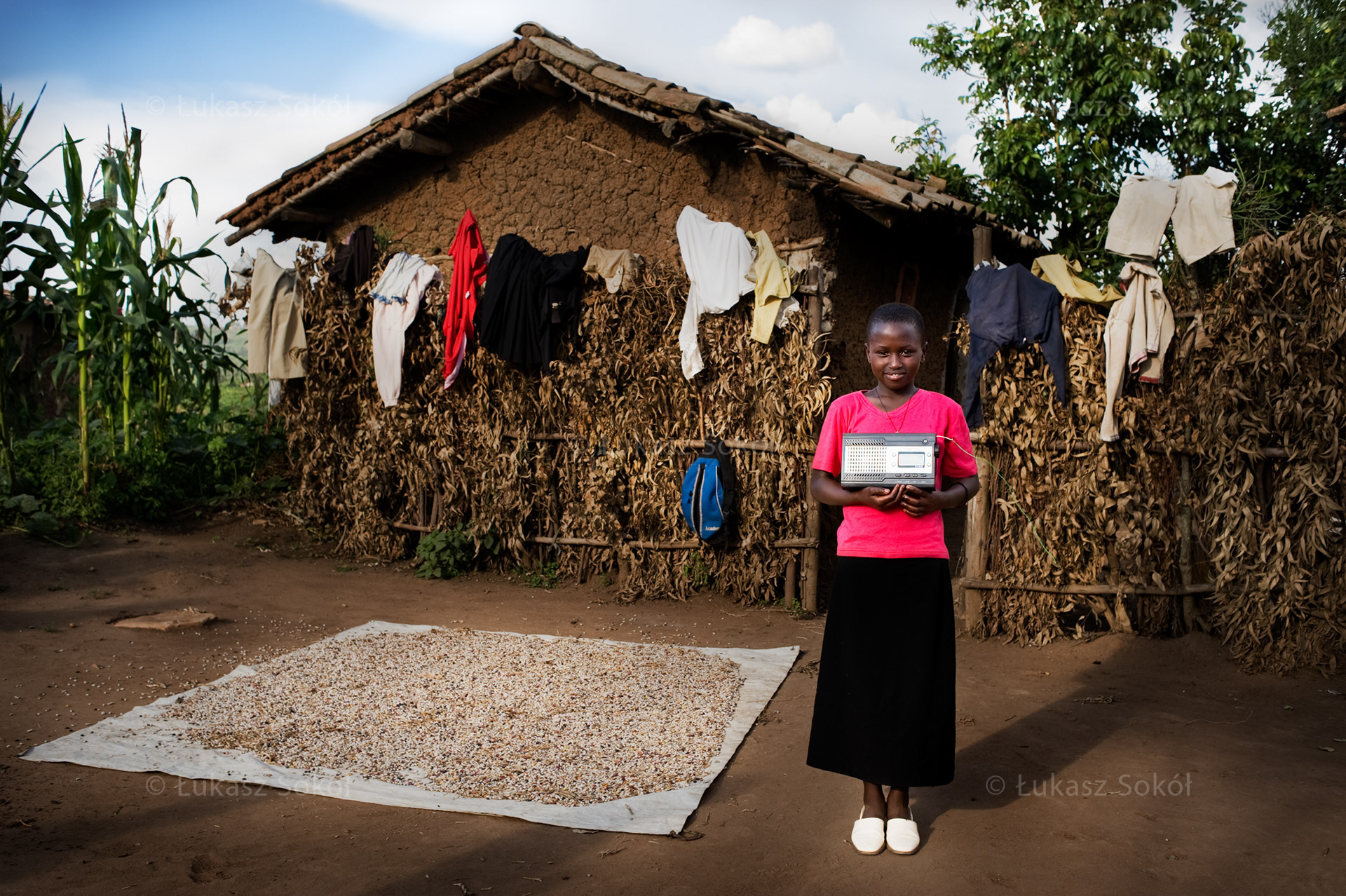 Grâce Uwizeyimana, aged 13, a 6th grade student of primary school. Her parents and sister are dead. She lives with her grandmother and 4 other children, cousins and members of her extended family. After school she fetches water home, collects brushwood and helps her grandmother prepare food. The radio belongs to her grandmother. She likes it, because it lets her listen to the news. She usually listens to a religious radio station. In the future she wants to be a nun. Her dream is to know more about God. Ruhango, Rwanda, 2010