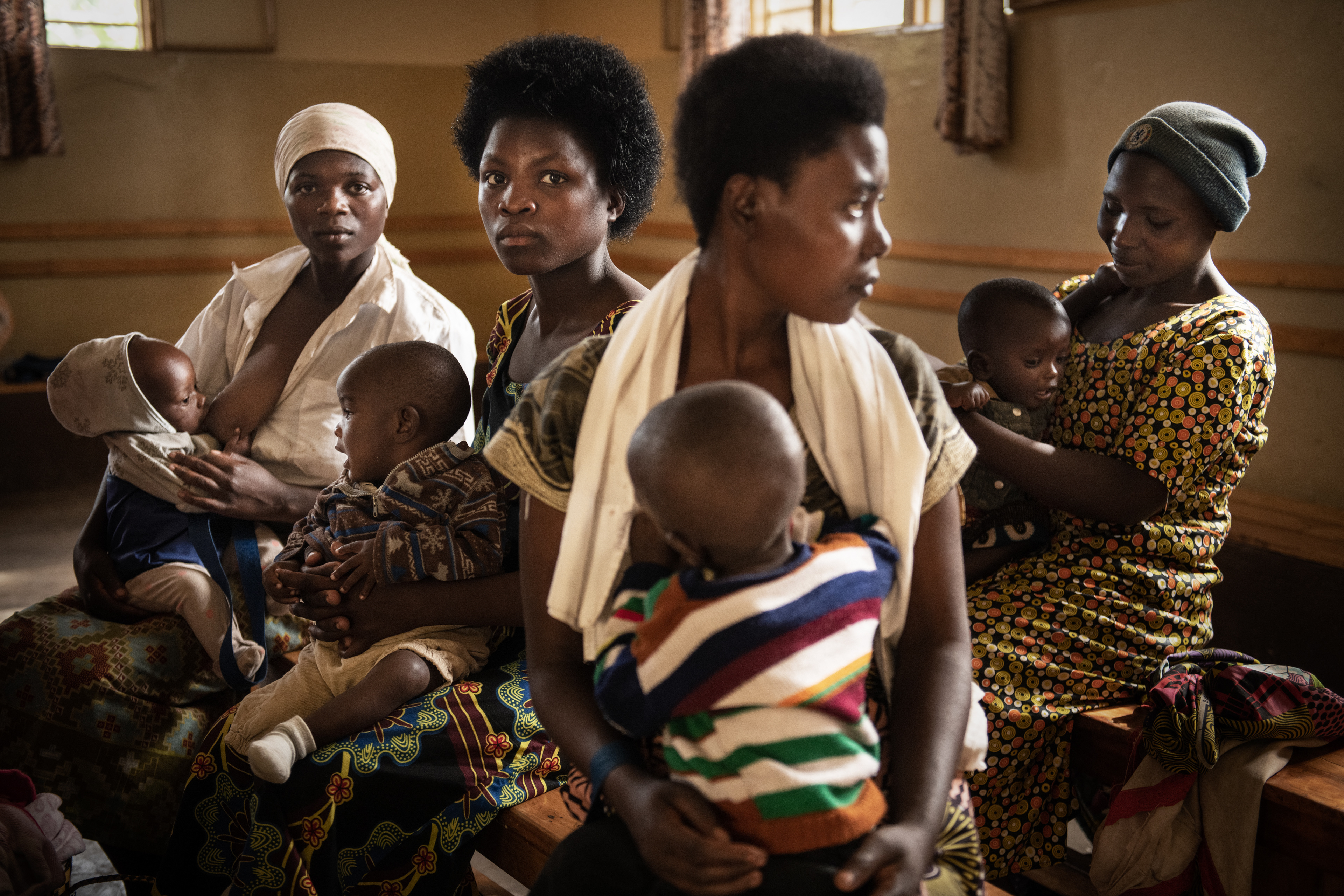 Mothers with malnourished children in a supplementary nutrition center run by the Polish Missionaries, Sisters of Angels in Nyakinama, Rwanda. Each child's weight is regularly monitored. In addition to receiving nutritious meals, mothers at the center are also taught how to prevent malnutrition, which is often not a result of poverty but merely a lack of resourcefulness on the part of young mothers. Rwanda 2019