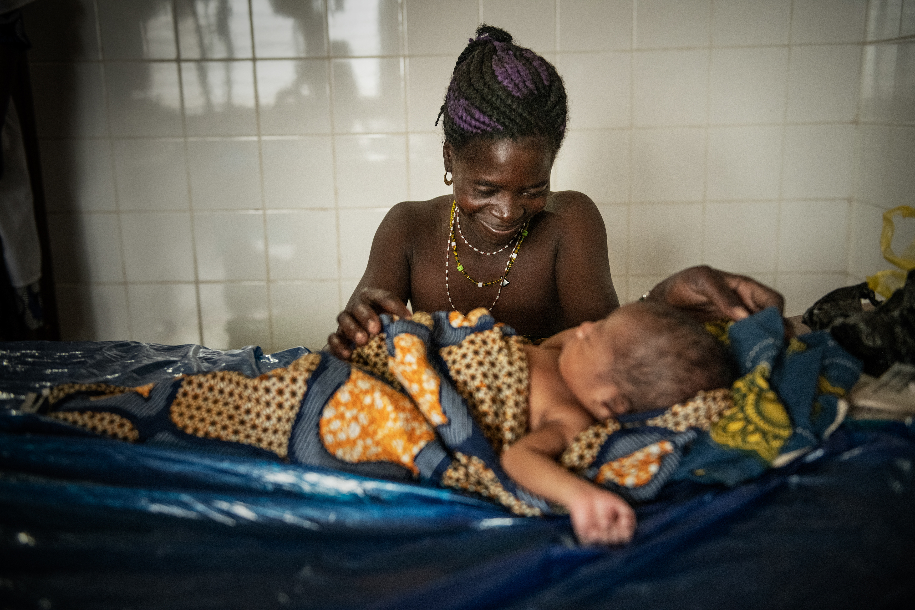 A Nampoch villager with her newborn baby at a clinic run by the missionary Sisters of St. Catherine. Togo 2023