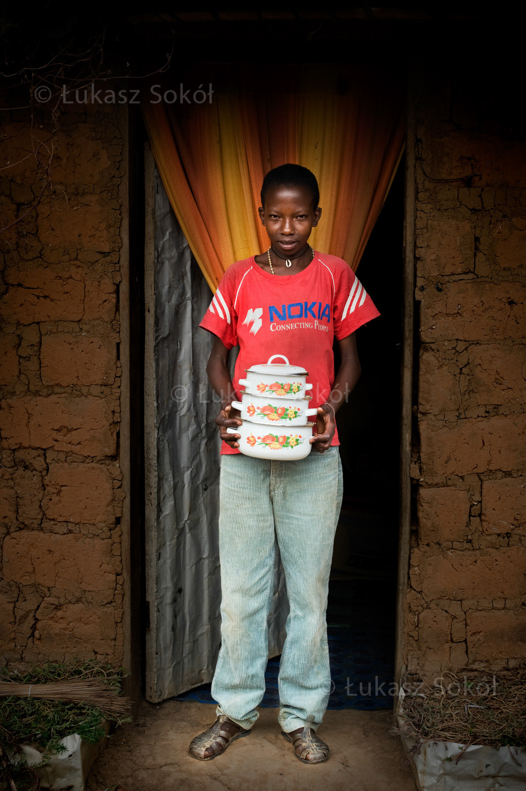 Bona Ventura Banda, aged 10, orphan, he does not have any brothers or sisters, he lives with his grandmother or his uncle alternatively. After school, he washes the dishes and helps his grandmother. When he grows up, he is going to be a policeman. He got the set of pots from his mother before she died. He dreams of having a bicycle. Betare-Oya, Cameroon, 2009