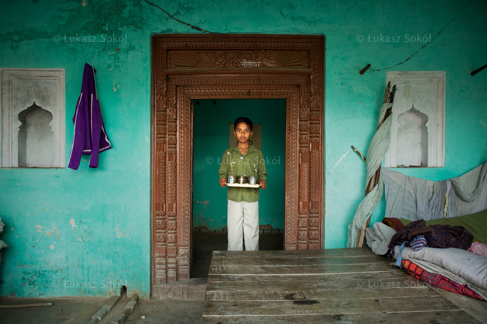 Asis, 12 years old. He has got a sister. He bought the chai tea cups at the market. They are very handy and are designed not to burn one's hands. They were expensive; one cost INR20 (USD0.40/EUR0.30). After school he works at home, helps cleaning, and feeds cows. When he grows up he will be an English teacher. At the moment he can speak English but only a little bit. Kakathi, India, 2012