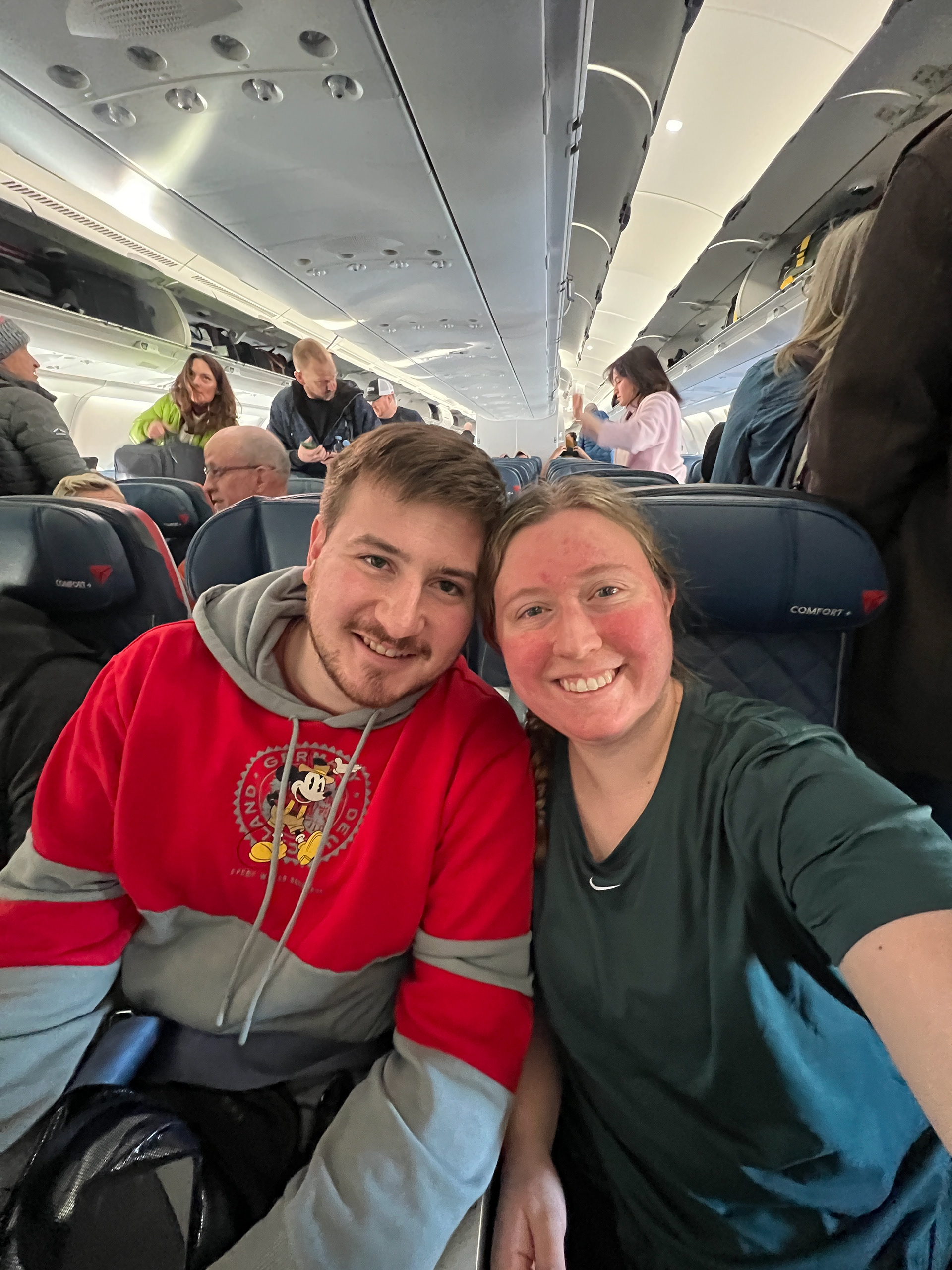Daniel and Emilie on their plane from MSP to AMS (Amsterdam)
